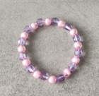 Bracciale elasticizzato con perle sfaccettate in plastica rosa e viola