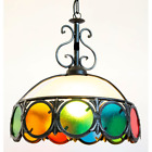 Grande lampadario in ferro battuto con vetri colorati